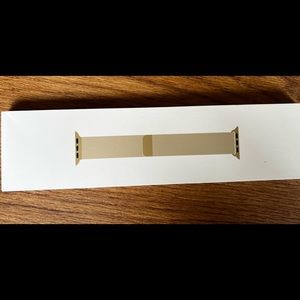 Apple Watch Band. It is gold, but not a bright gold just so you realize that